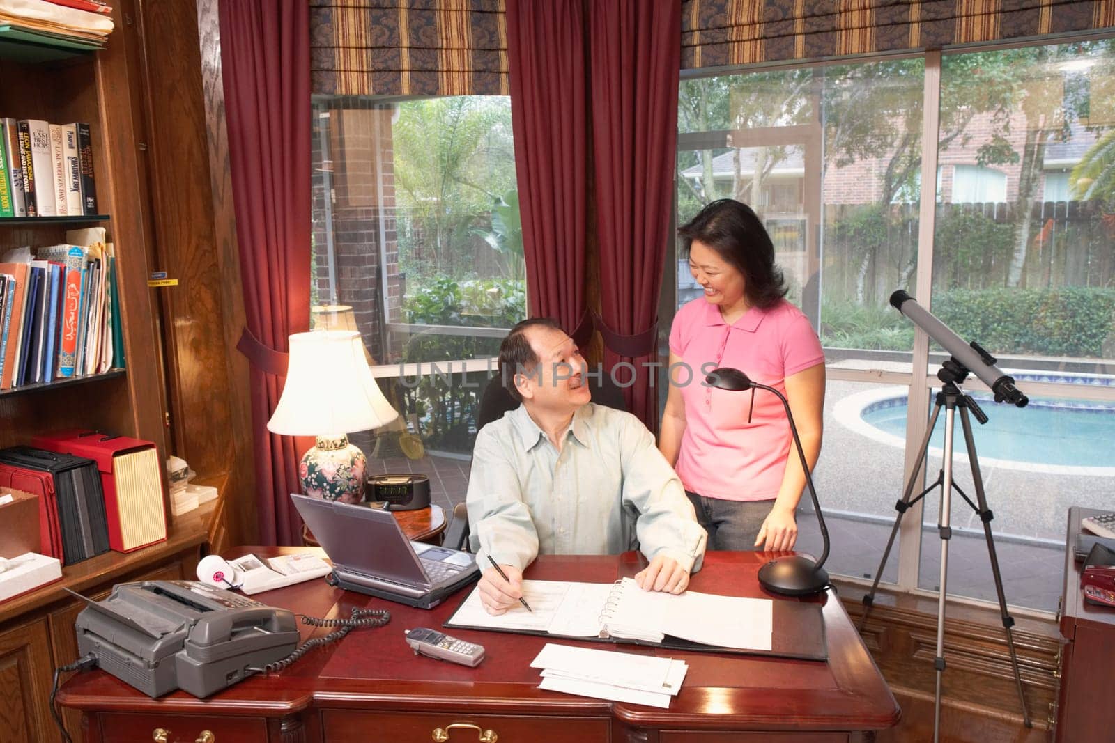 High angle view of a senior man talking to a mature woman