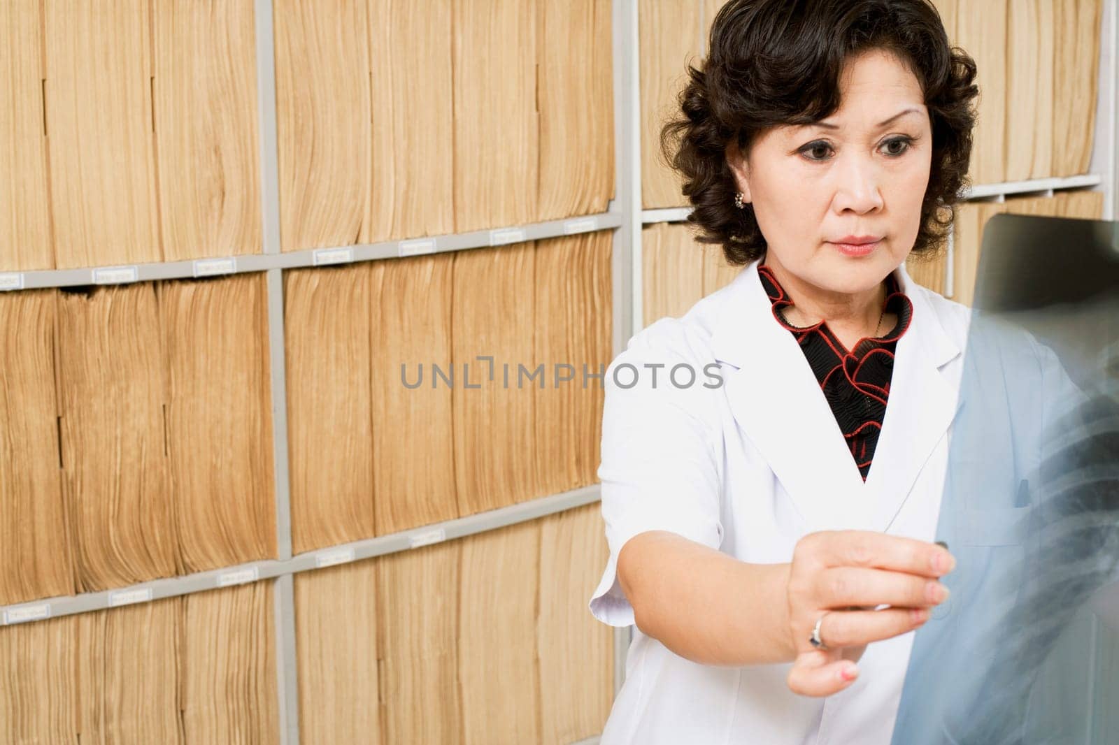 Close-up of a female doctor looking an X-Ray image