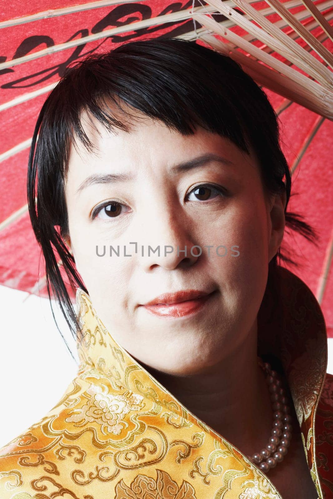 Portrait of a mid adult woman holding a parasol