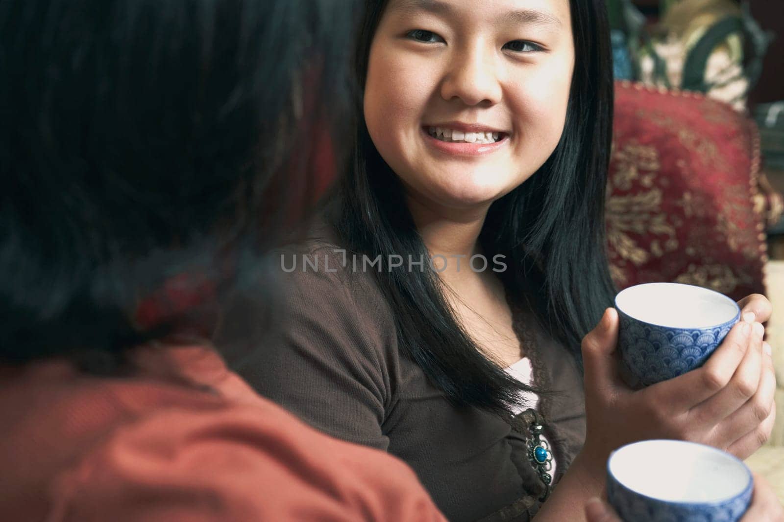 Close-up of a girl holding a tea cup