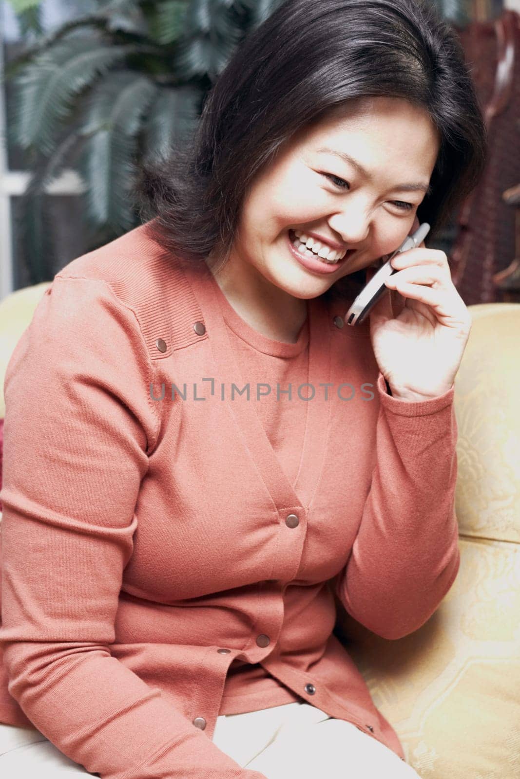Close-up of a mature woman using a mobile phone