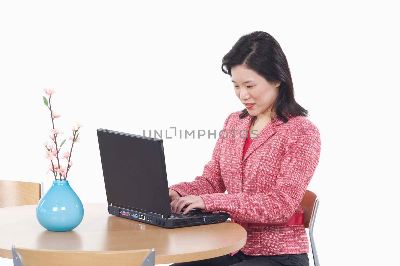 Side profile of a businesswoman using a laptop