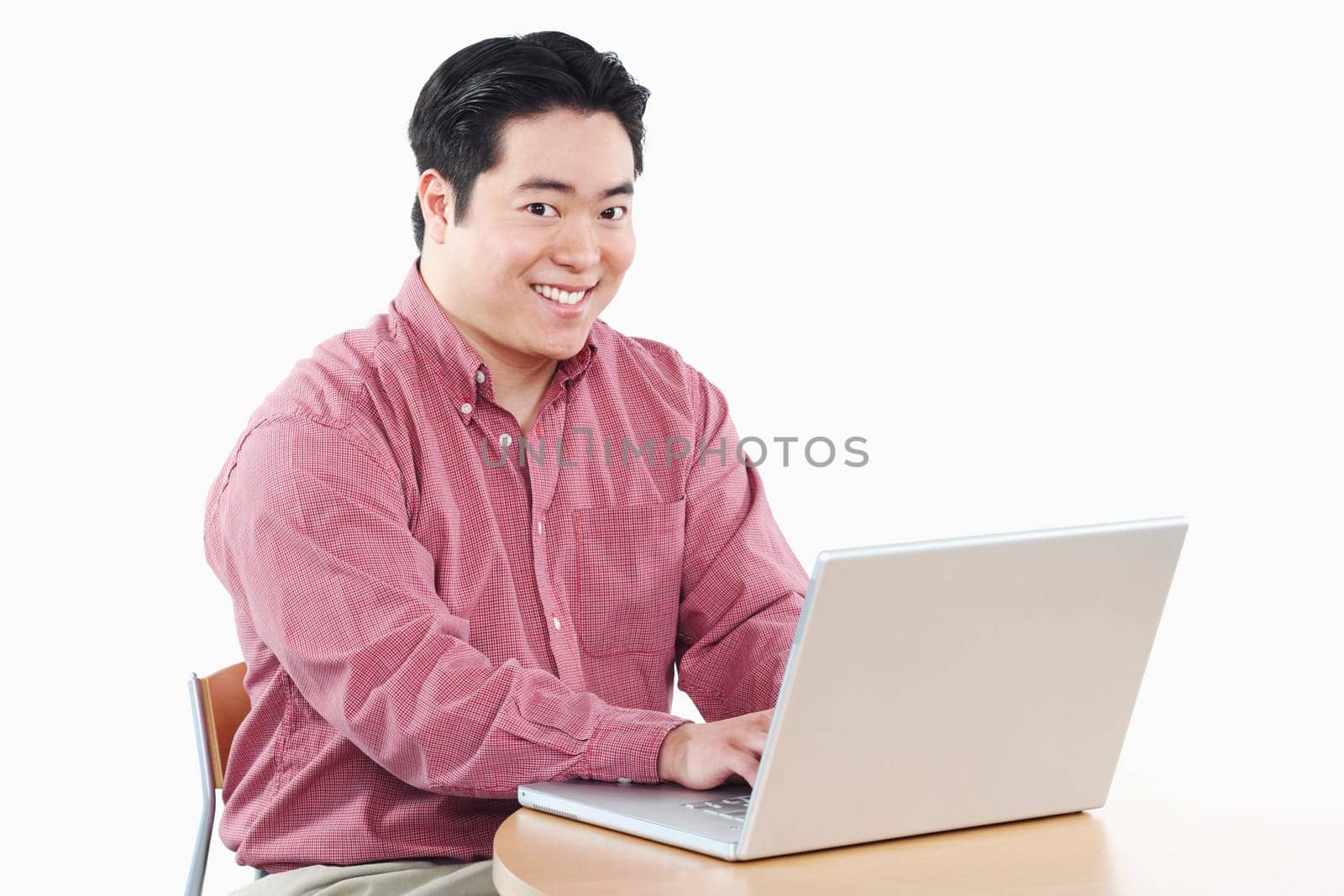 Portrait of a businessman using a laptop