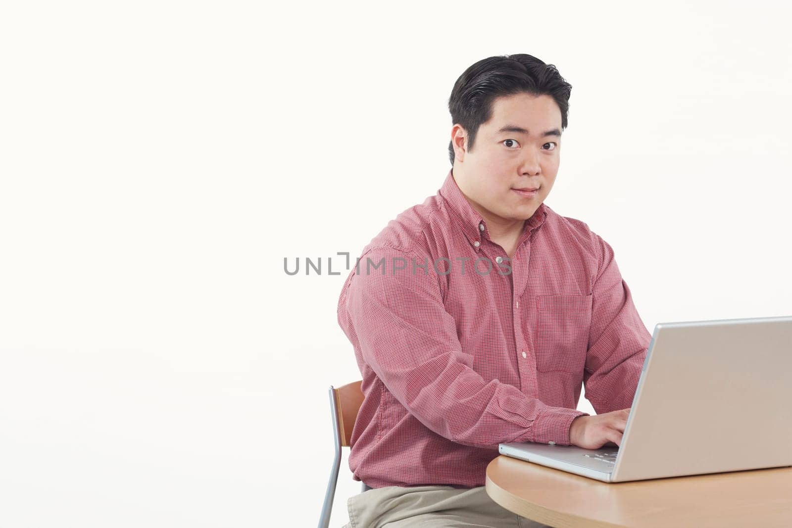 Portrait of a businessman using a laptop