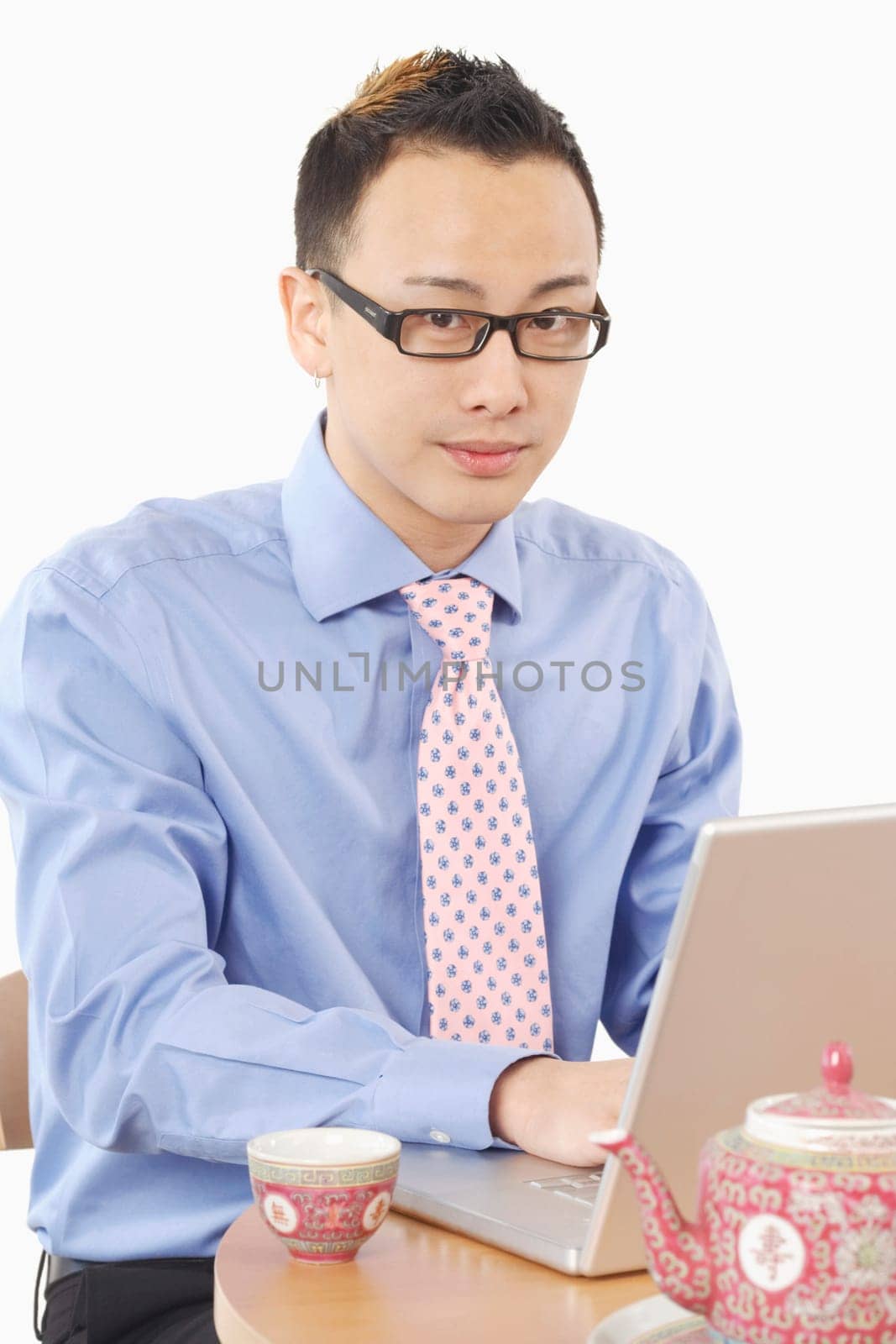 Portrait of a businessman using a laptop