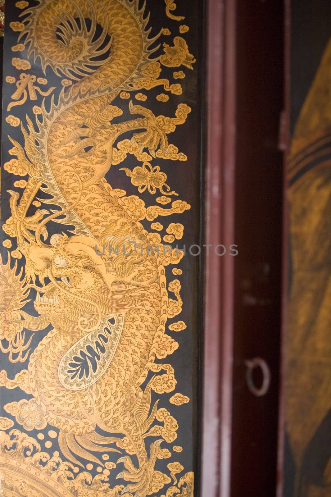 Close-up of a painting of a dragon in a temple