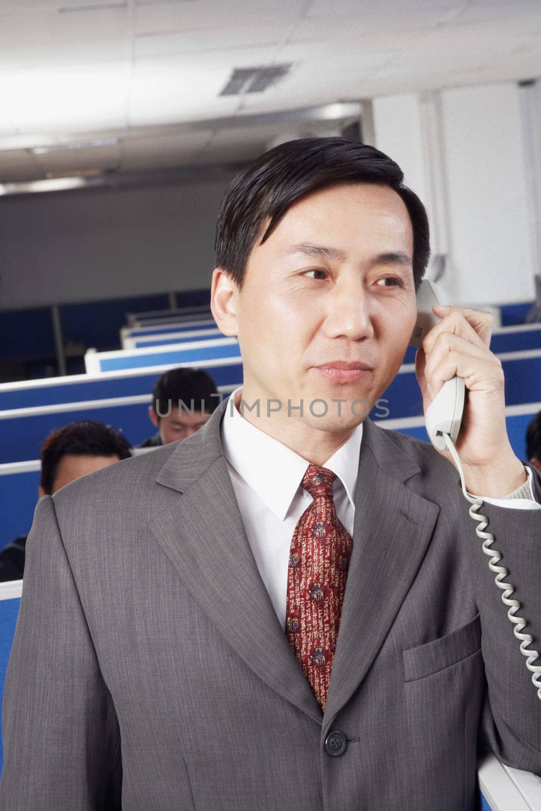 Close-up of a businessman talking on the telephone