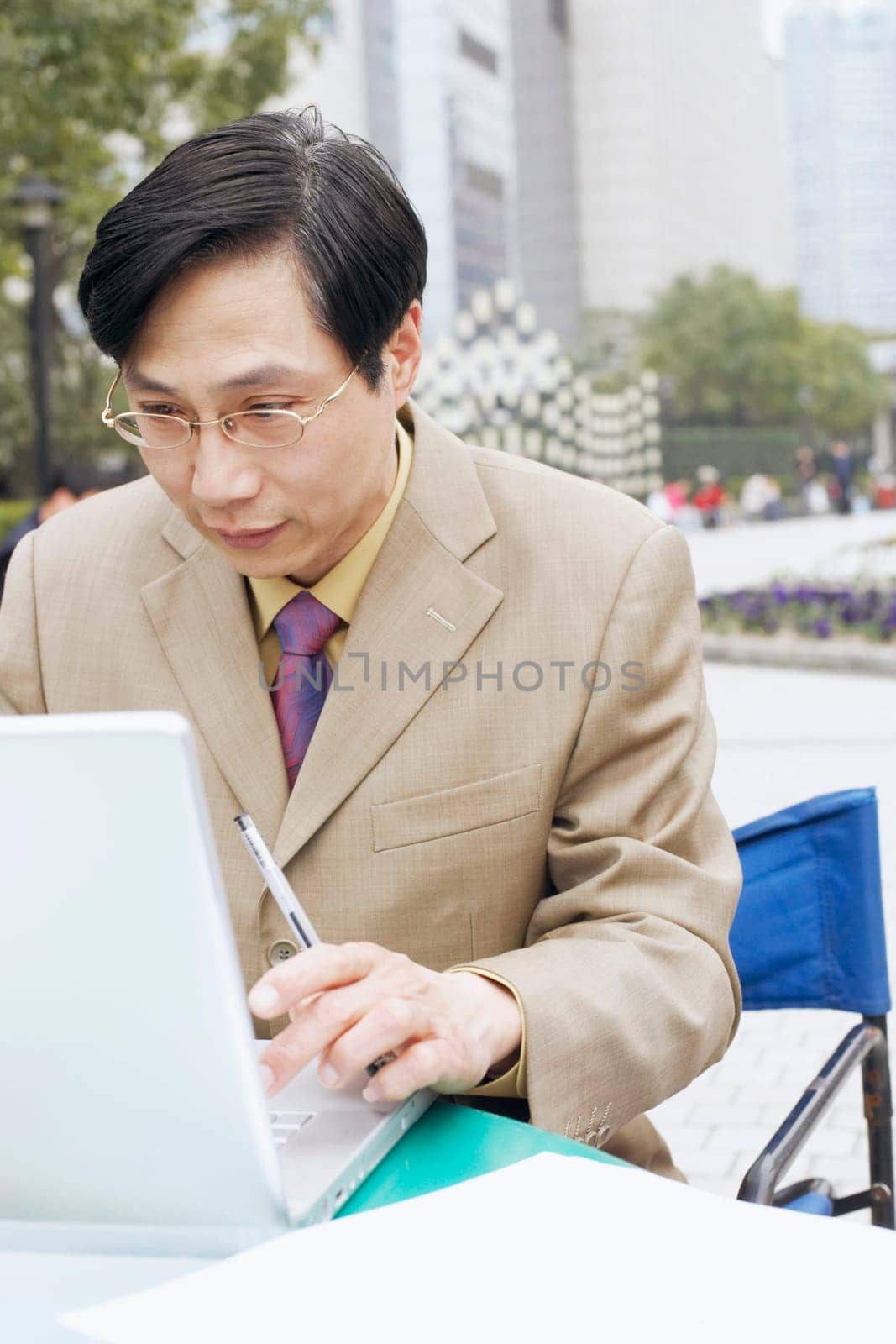 Close-up of a businessman using a laptop