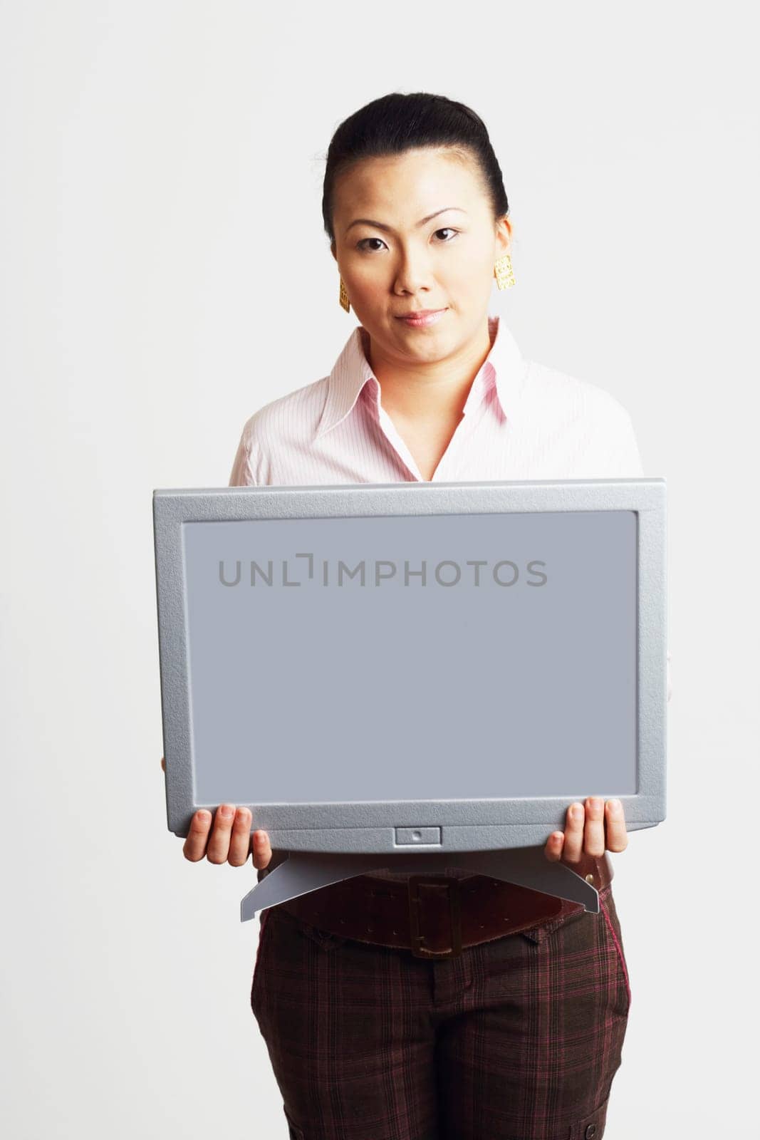 Portrait of a businesswoman holding the model of a computer monitor with progress reports