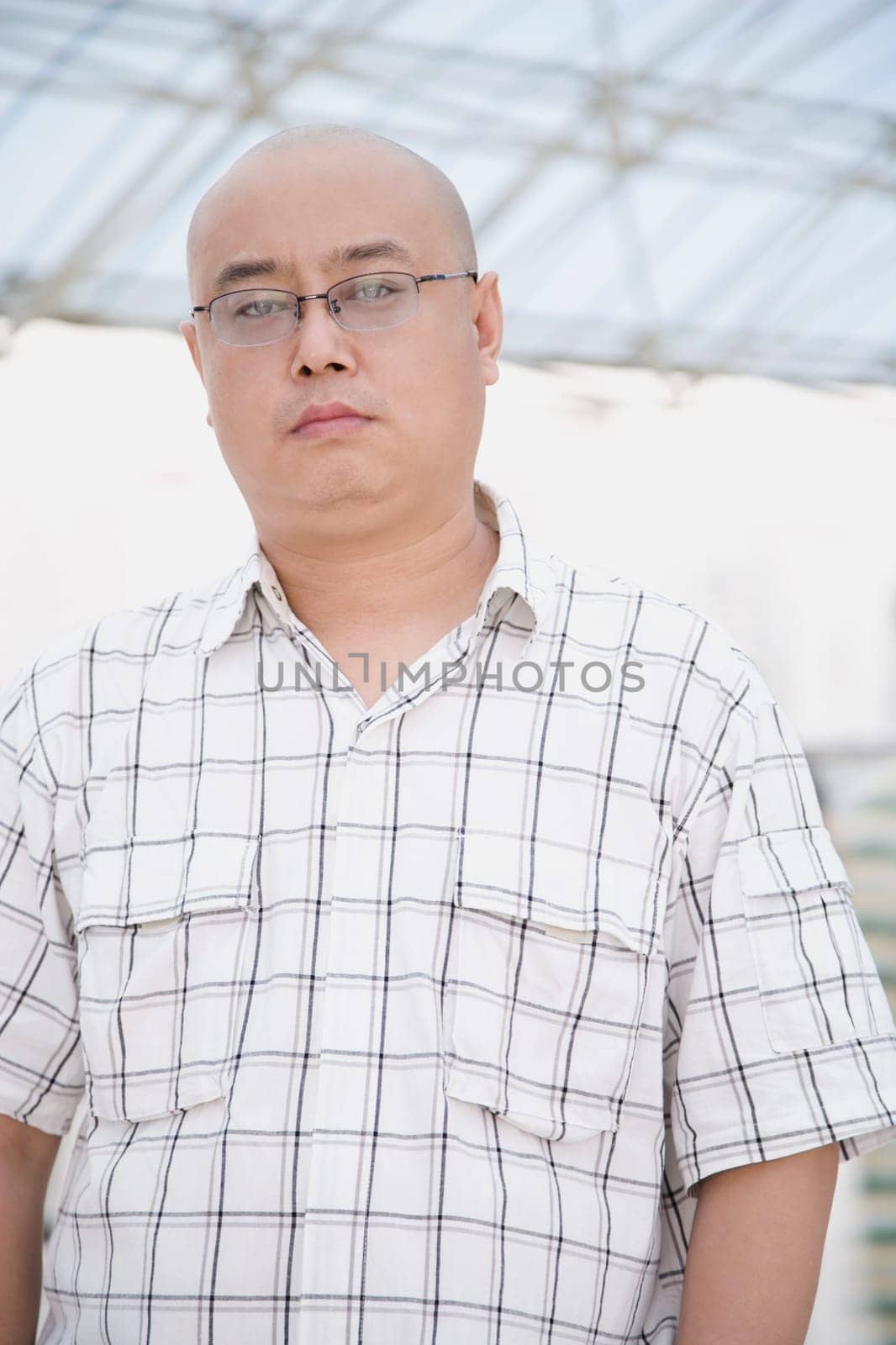 Portrait of a mid adult man standing in a corridor
