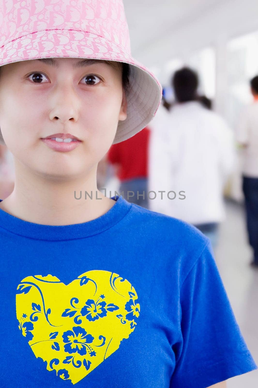 Portrait of a young woman in a corridor