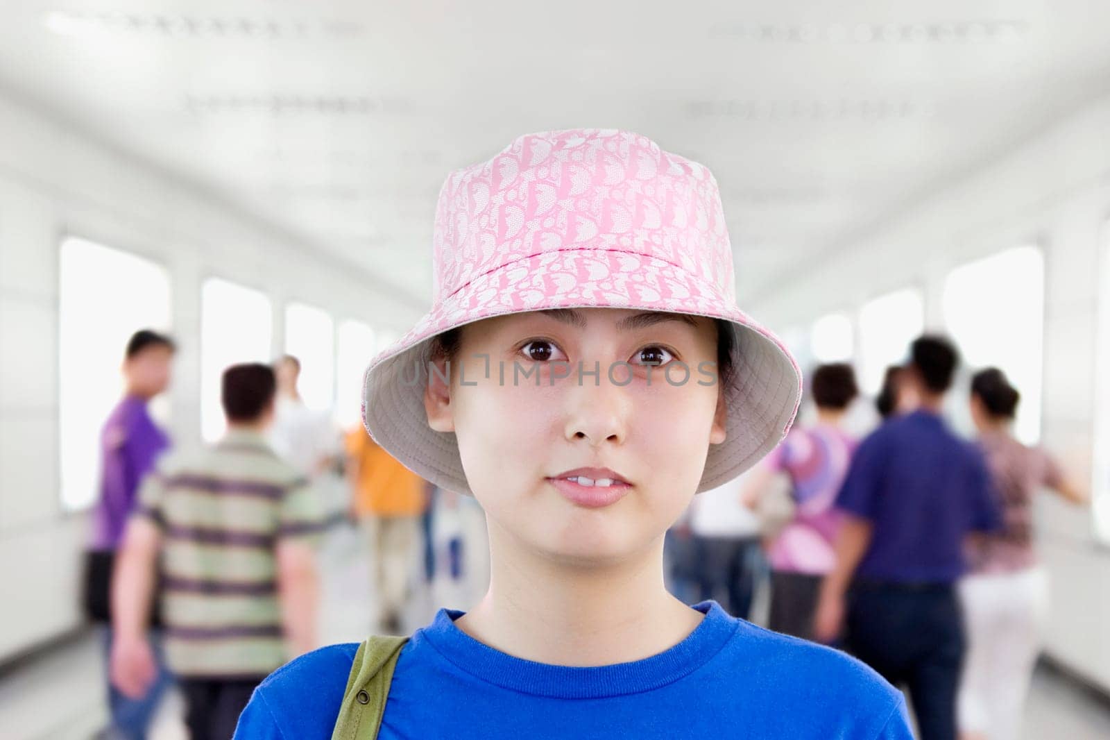 Portrait of a young woman in a corridor