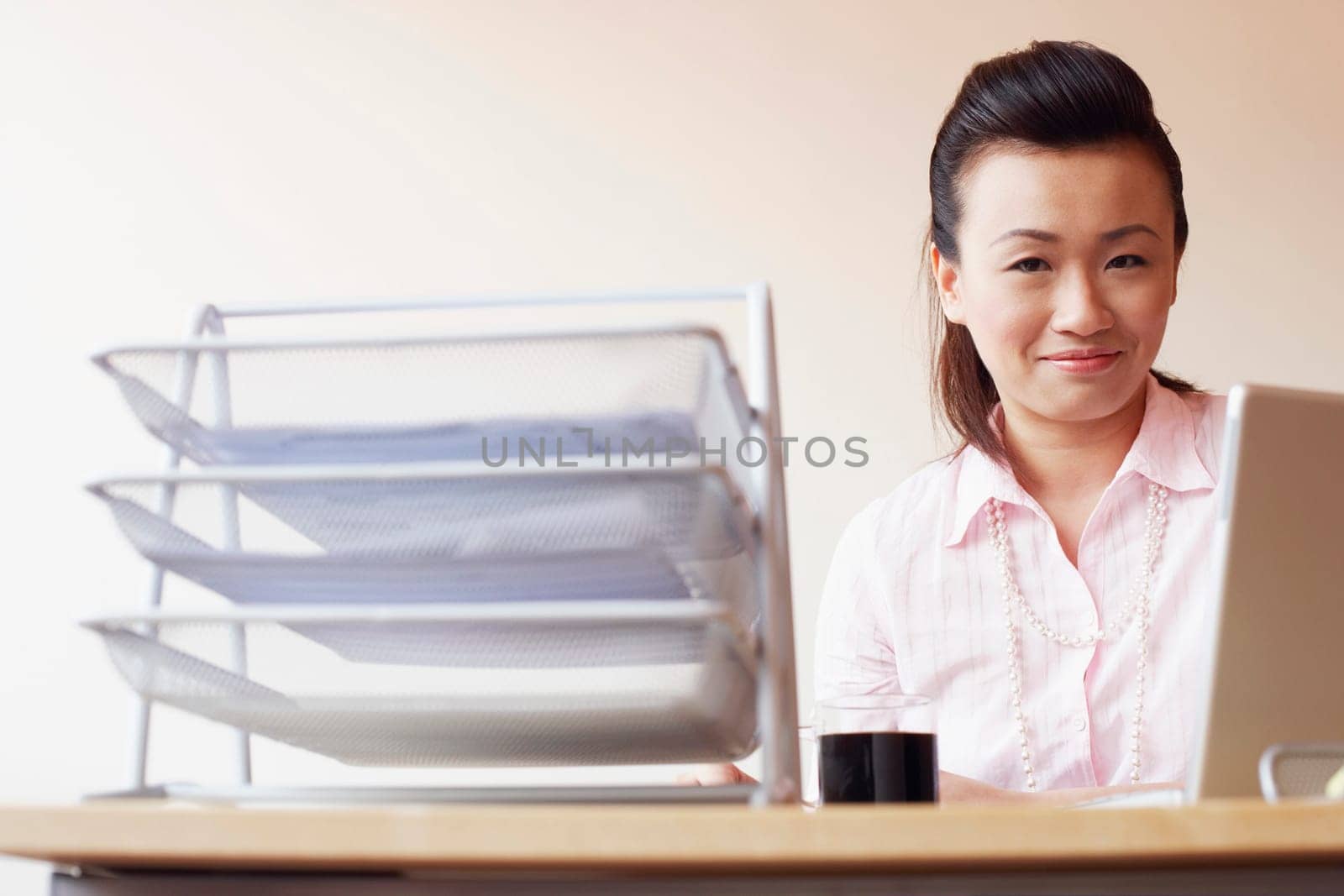 Portrait of a businesswoman sitting in an office and smiling