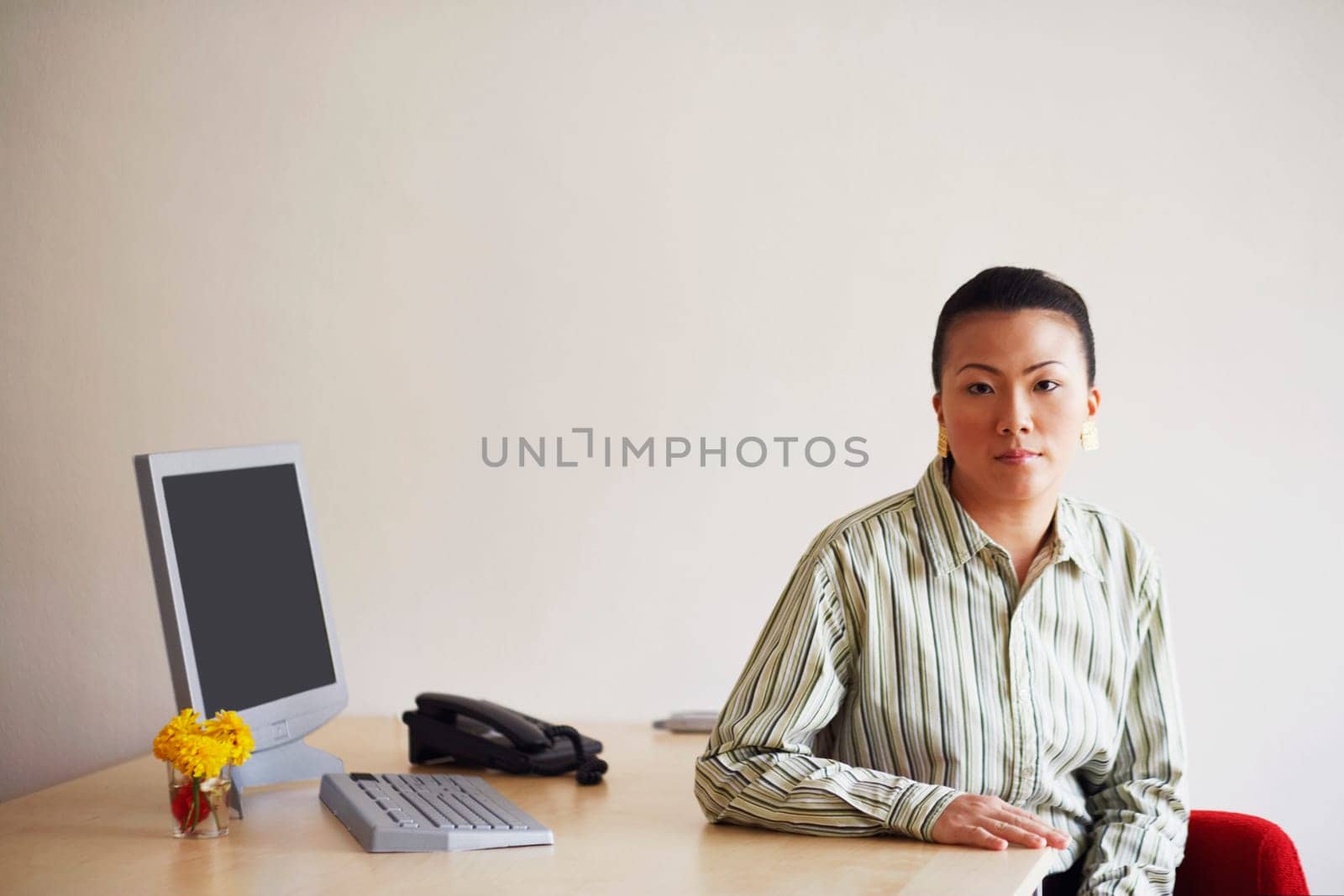 Portrait of a young woman sitting in an office