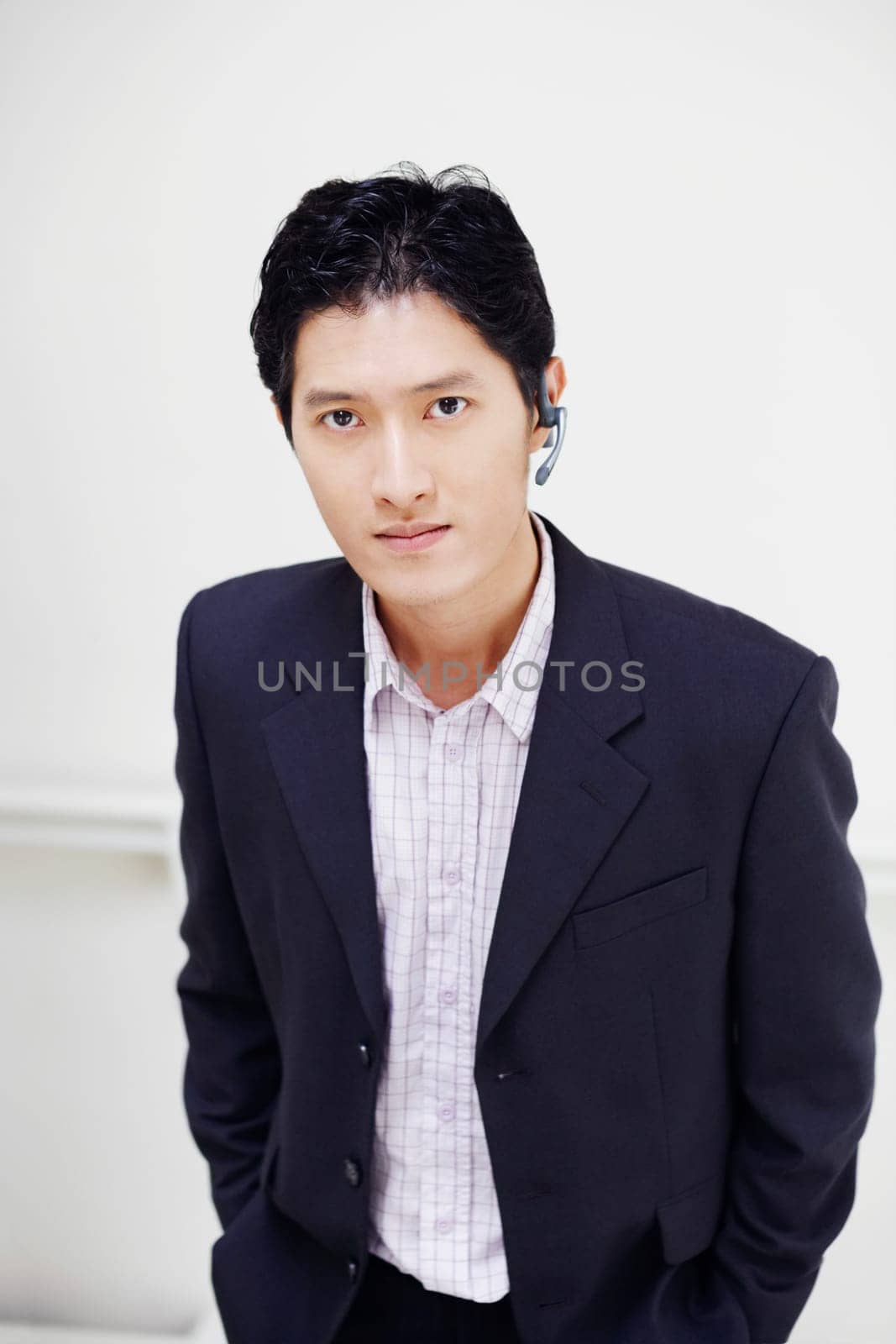 Portrait of a businessman standing with his hands in his pockets