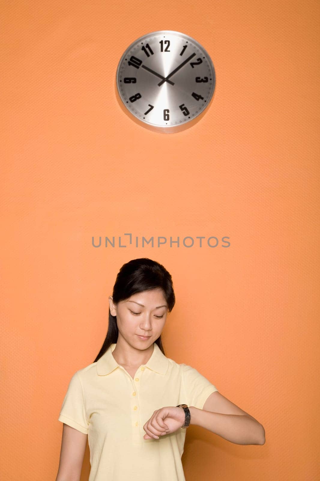 Female office worker checking the time