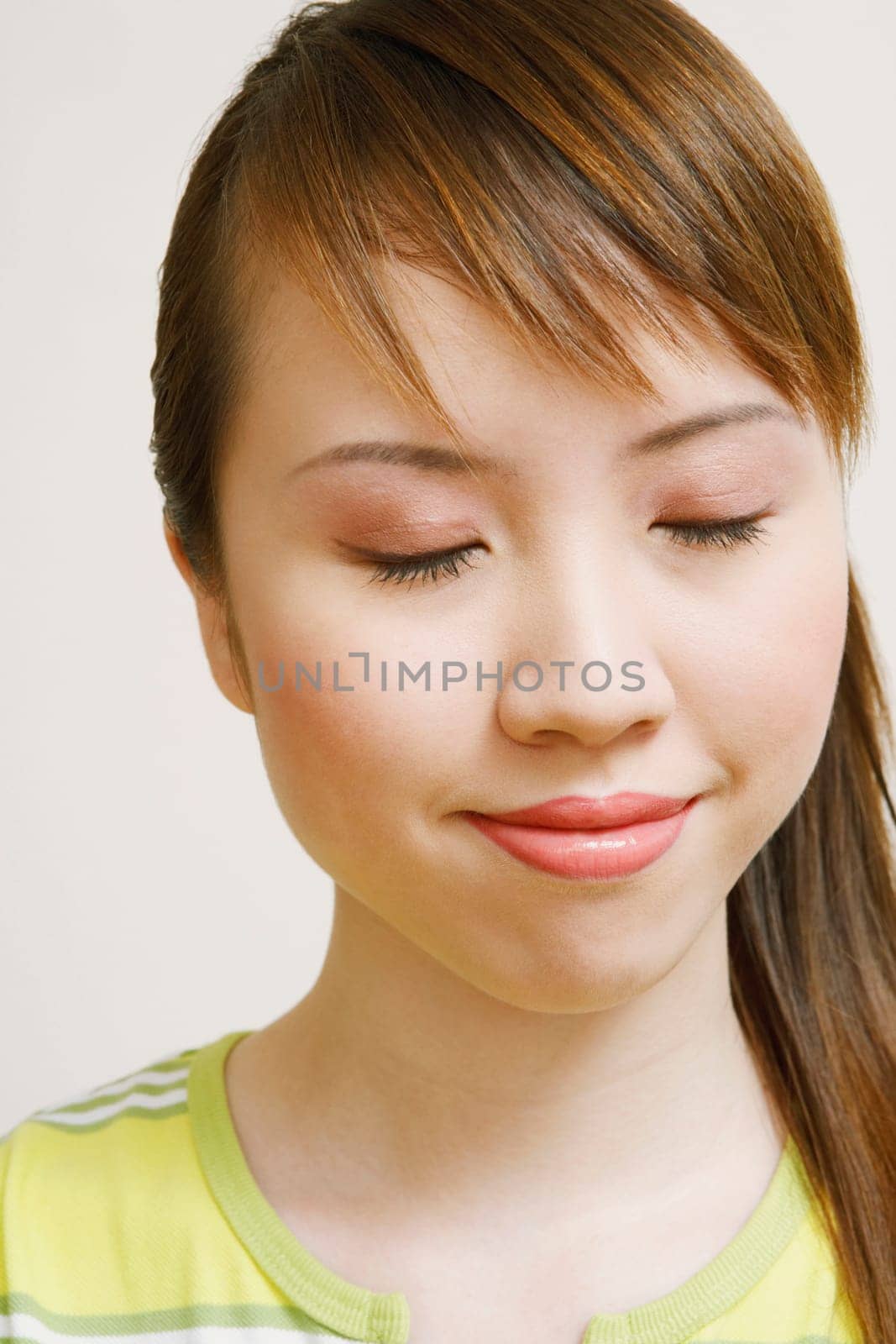 Close-up of a young woman with her eyes closed