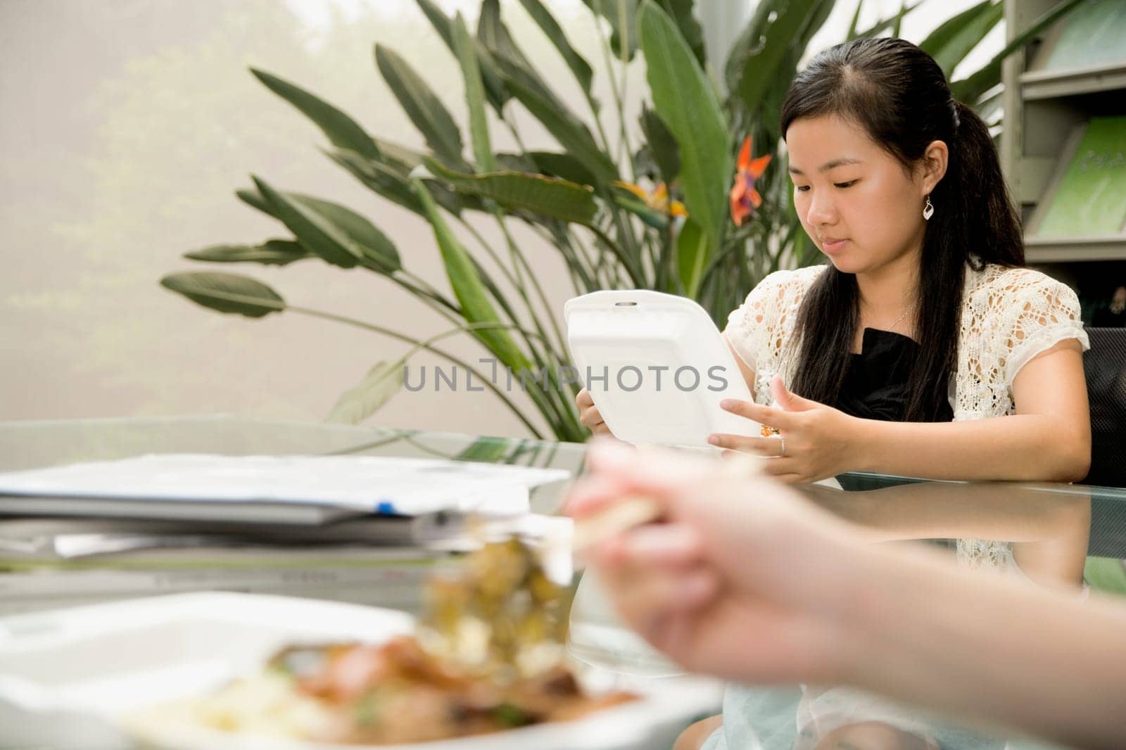 Female office worker having lunch