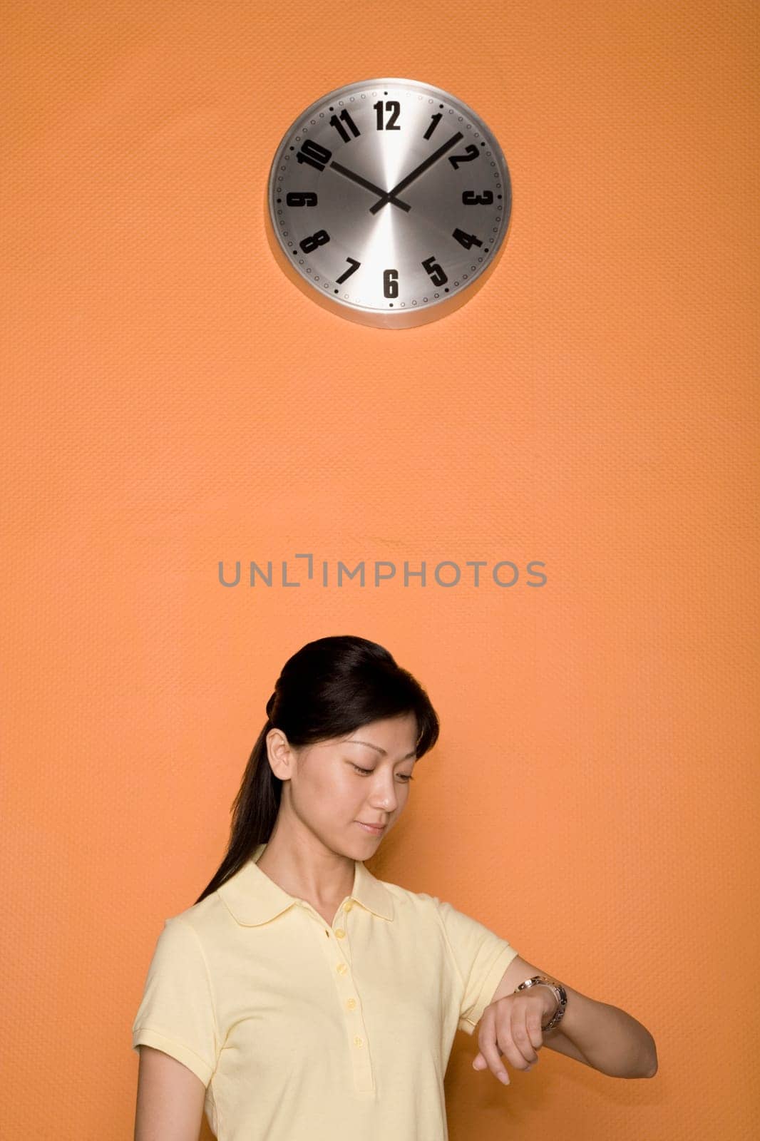 Close-up of a female office worker checking the time