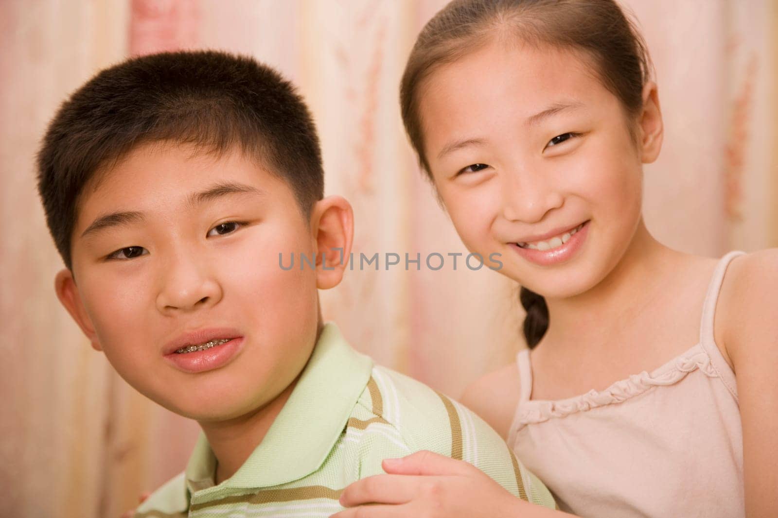 Portrait of a boy smiling with his sister