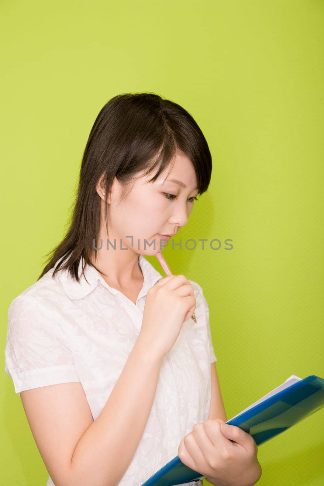 Female office worker holding a file