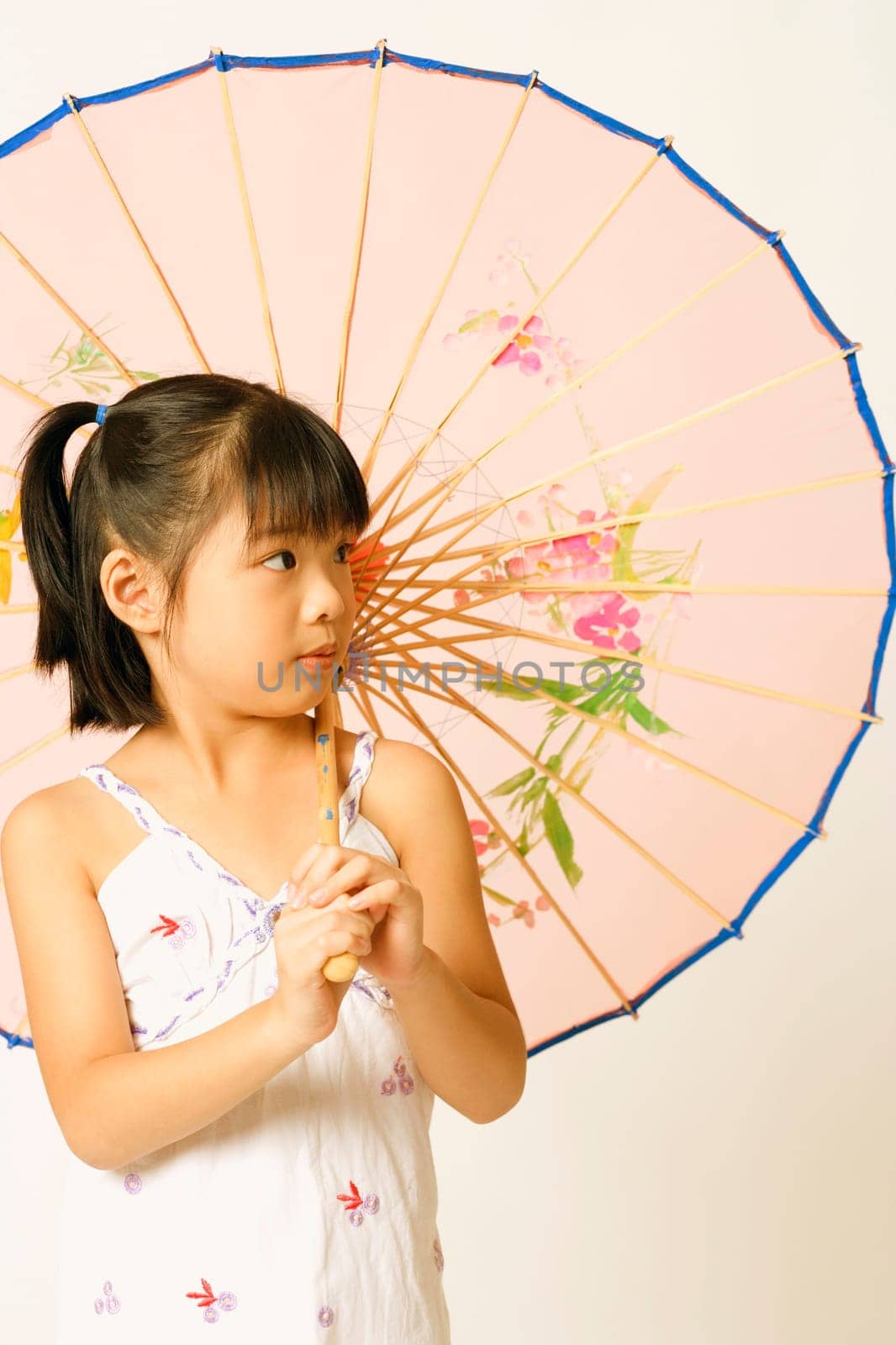 Close-up of a girl holding a parasol