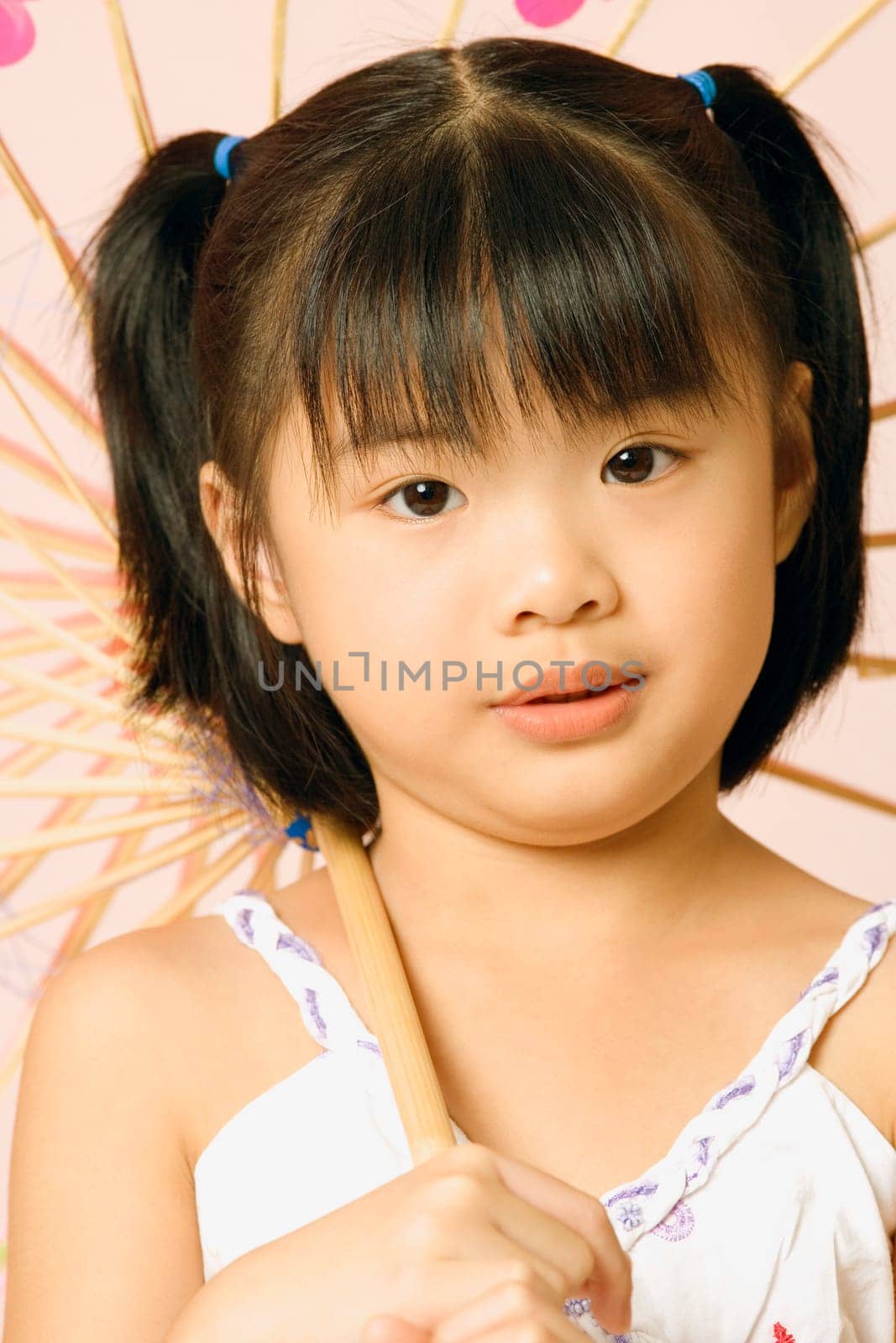 Portrait of a girl holding a parasol