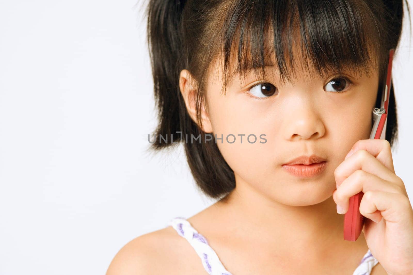 Close-up of a girl holding a mobile phone