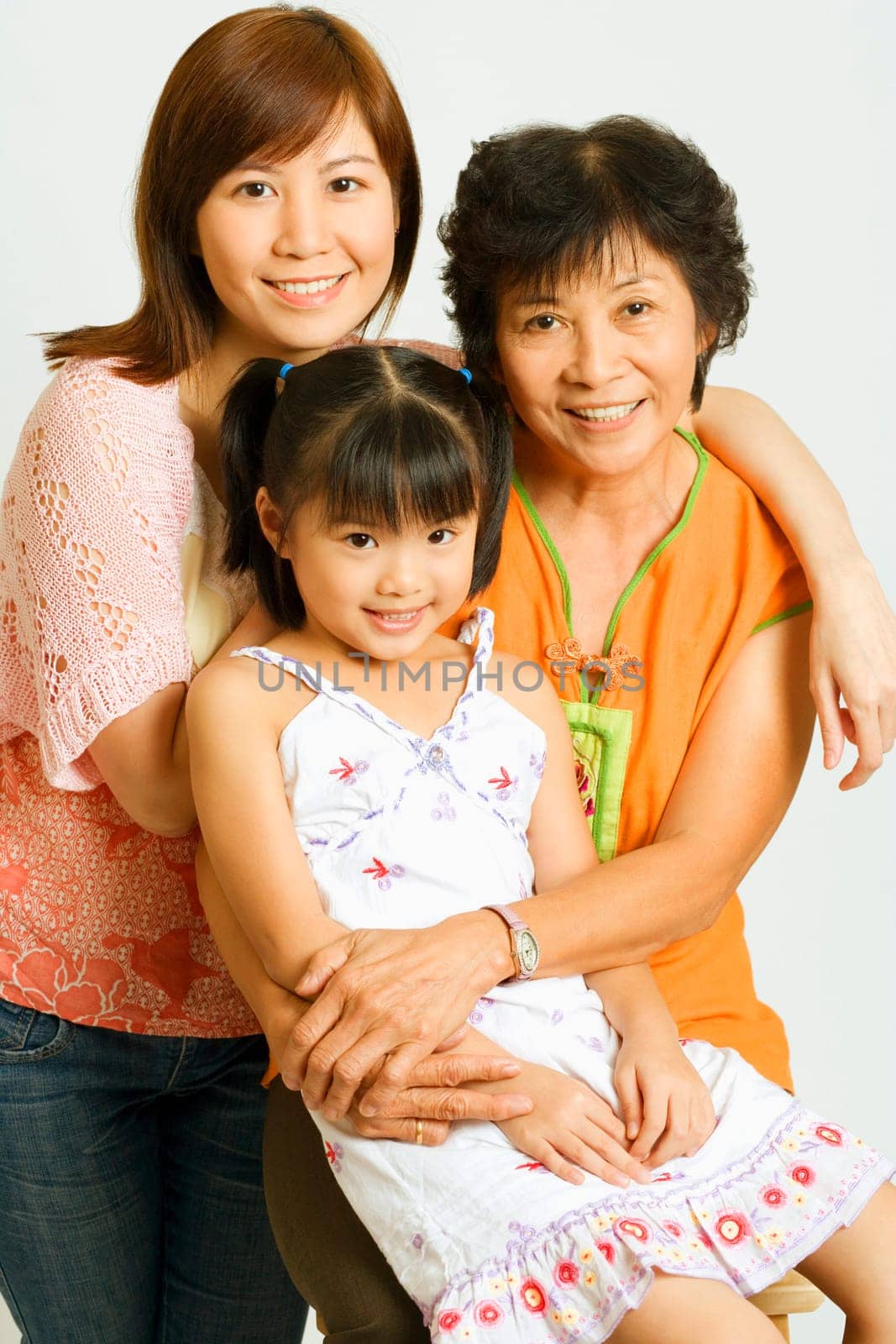 Portrait of a mature woman with her daughter and her granddaughter