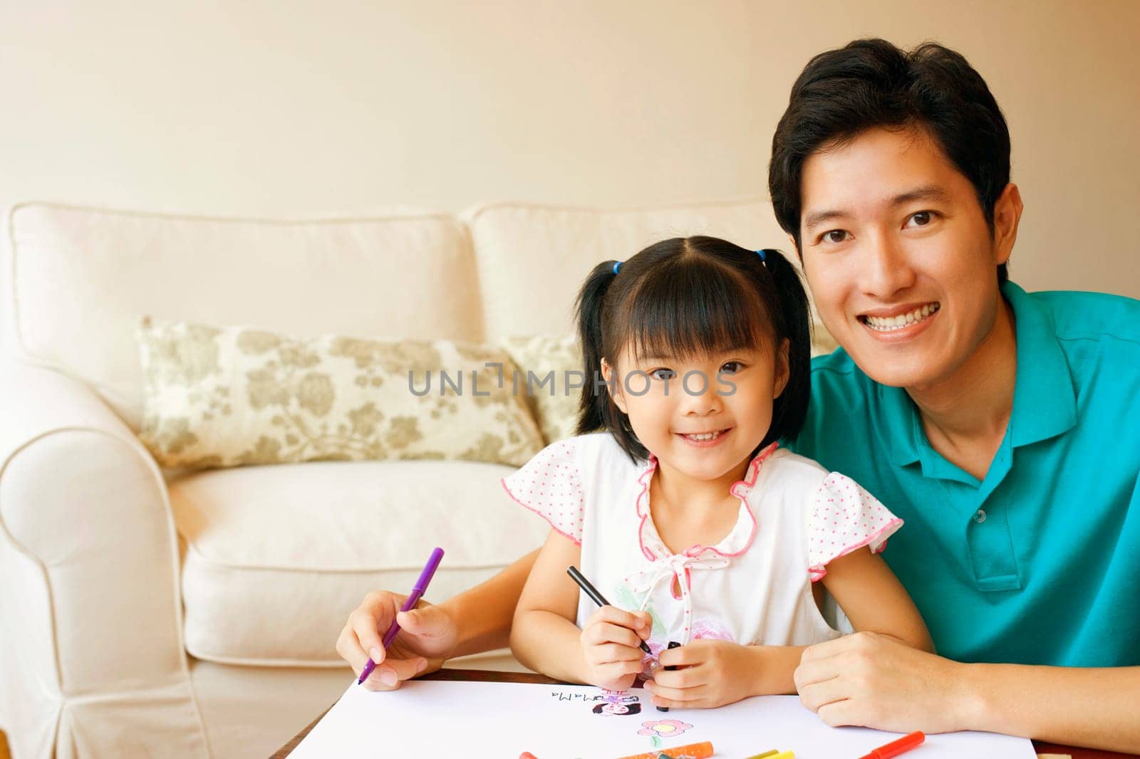 Portrait of a young man with his son and daughter