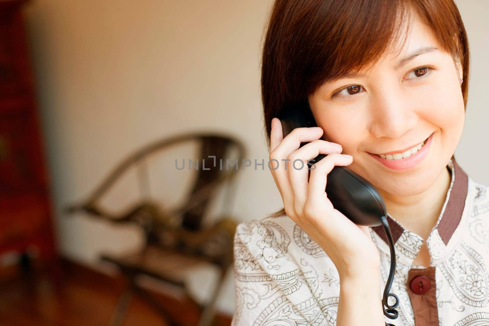 Close-up of a young woman talking on the telephone