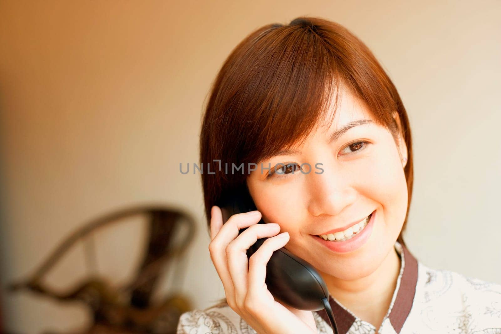 Close-up of a young woman talking on the telephone
