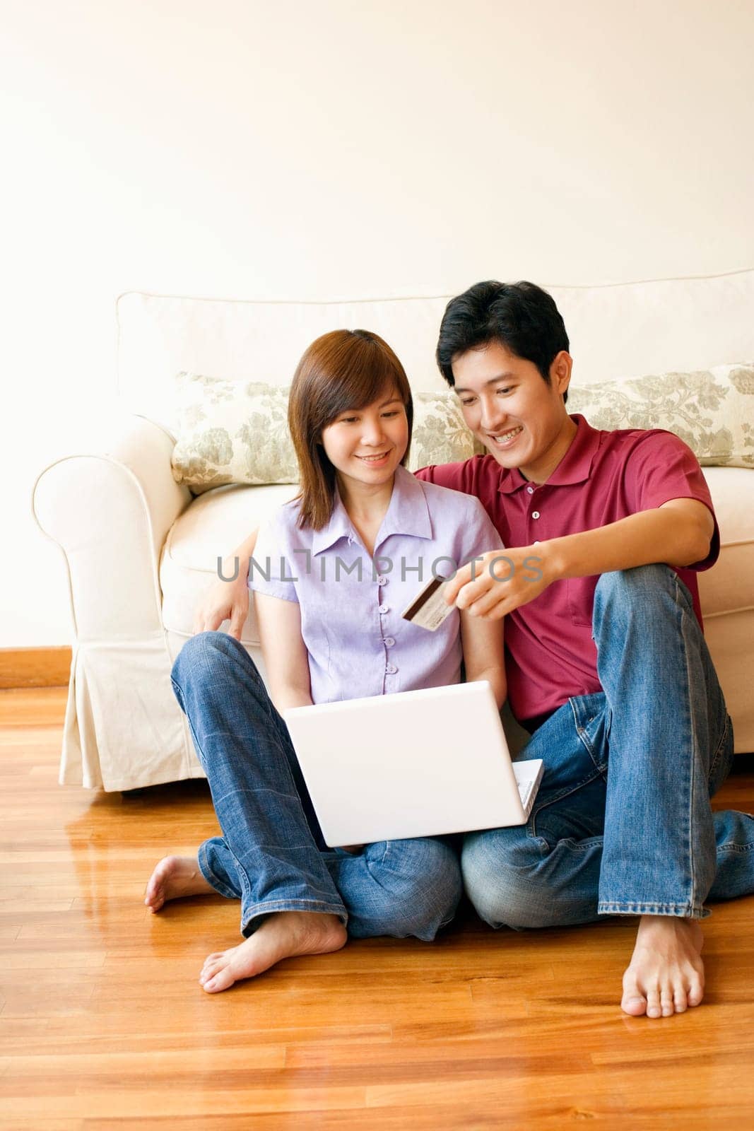 Young couple shopping online with a credit card