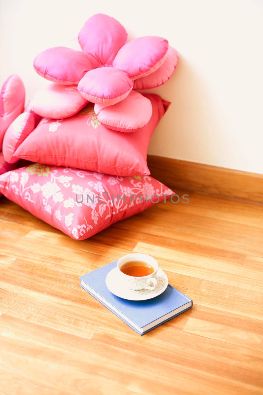 Close-up of pillows on a wooden floor