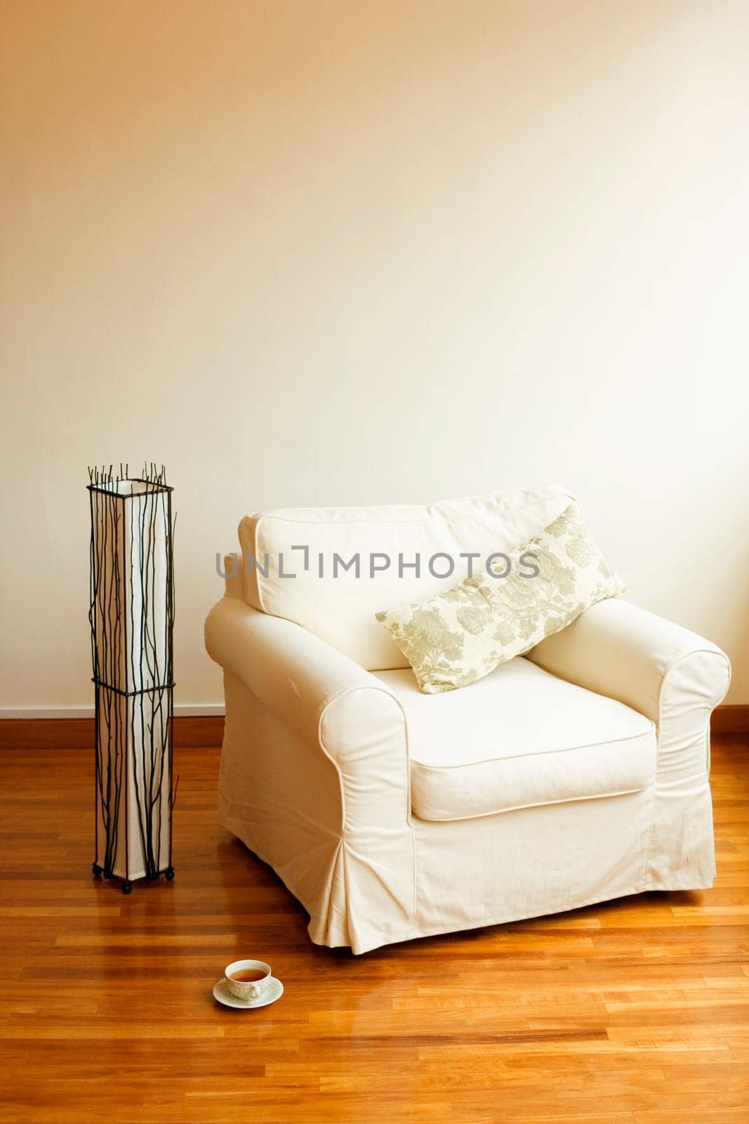 Close-up of an armchair on a wooden floor