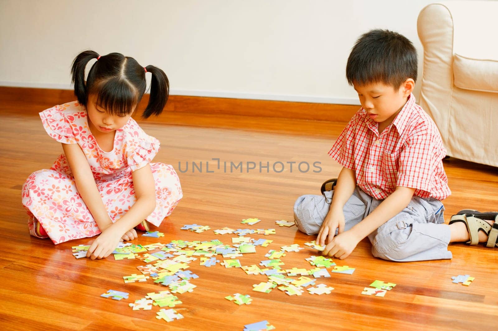 Boy playing with a jigsaw puzzle