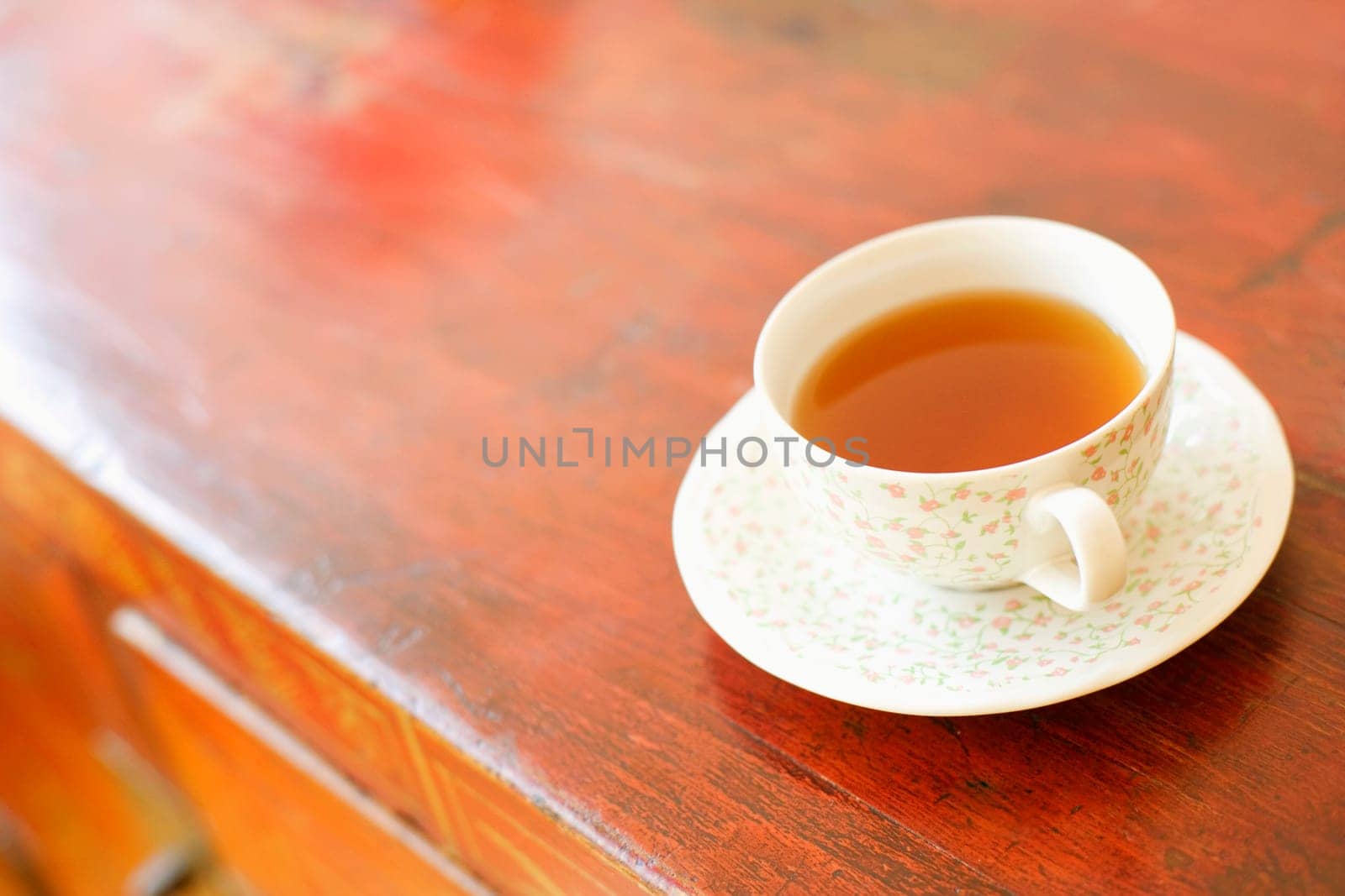 Close-up of a cup of coffee on a cabinet