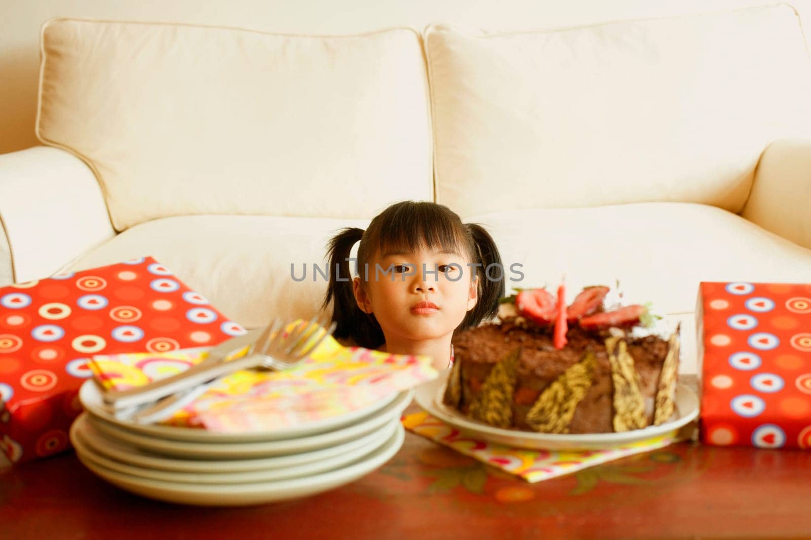Girl looking at a cake