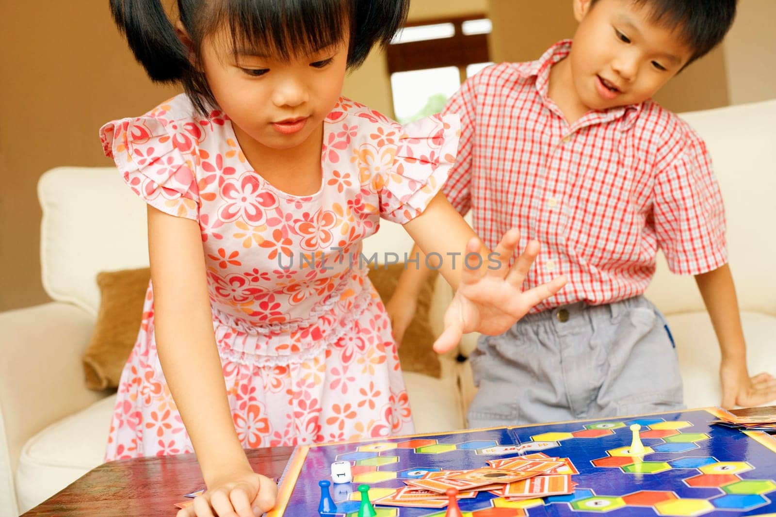 Close-up of a boy playing with his sister