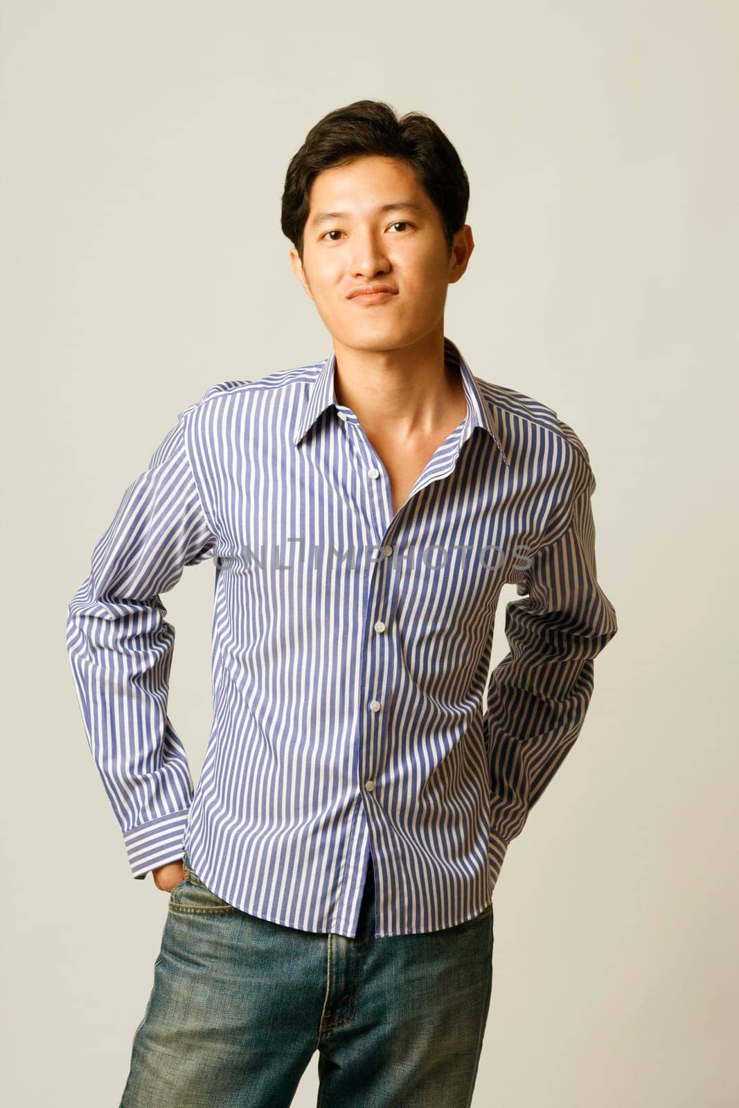 Portrait of a young man smirking