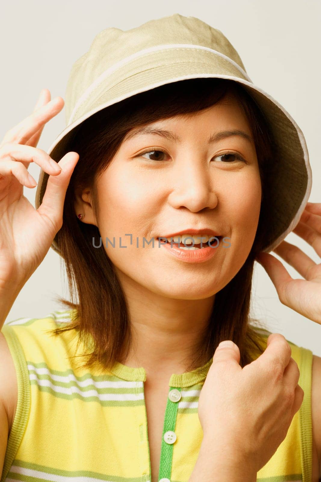 Close-up of a young woman wearing a hat