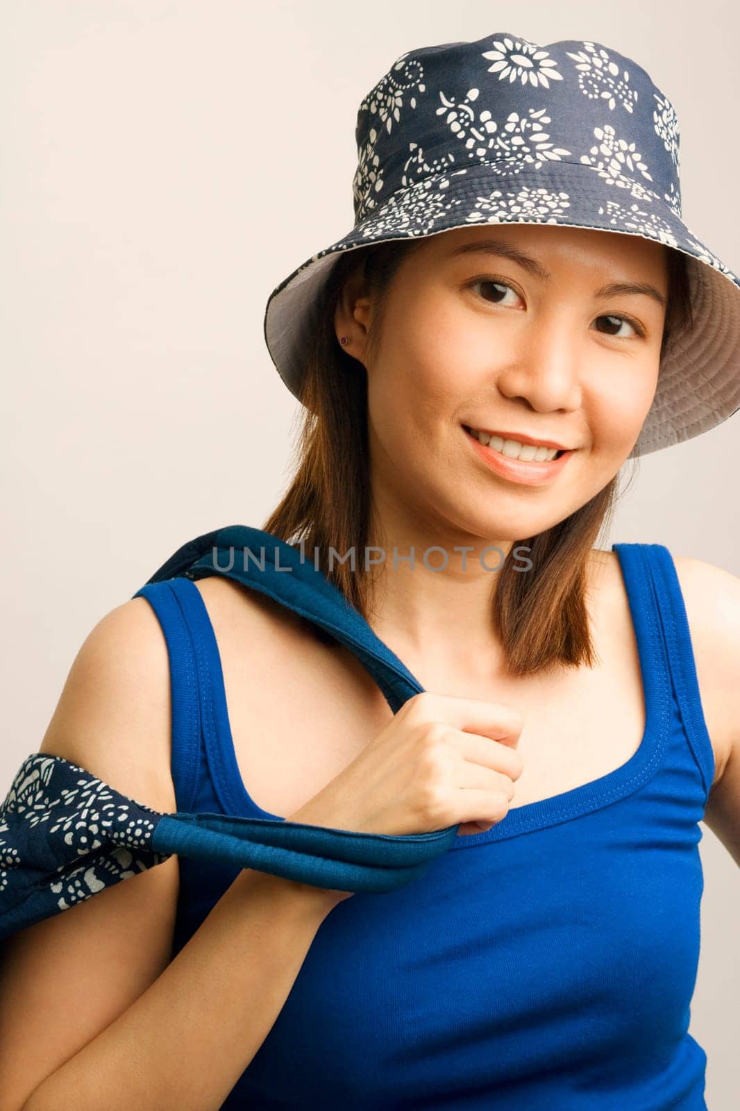 Portrait of a young woman holding a hand bag