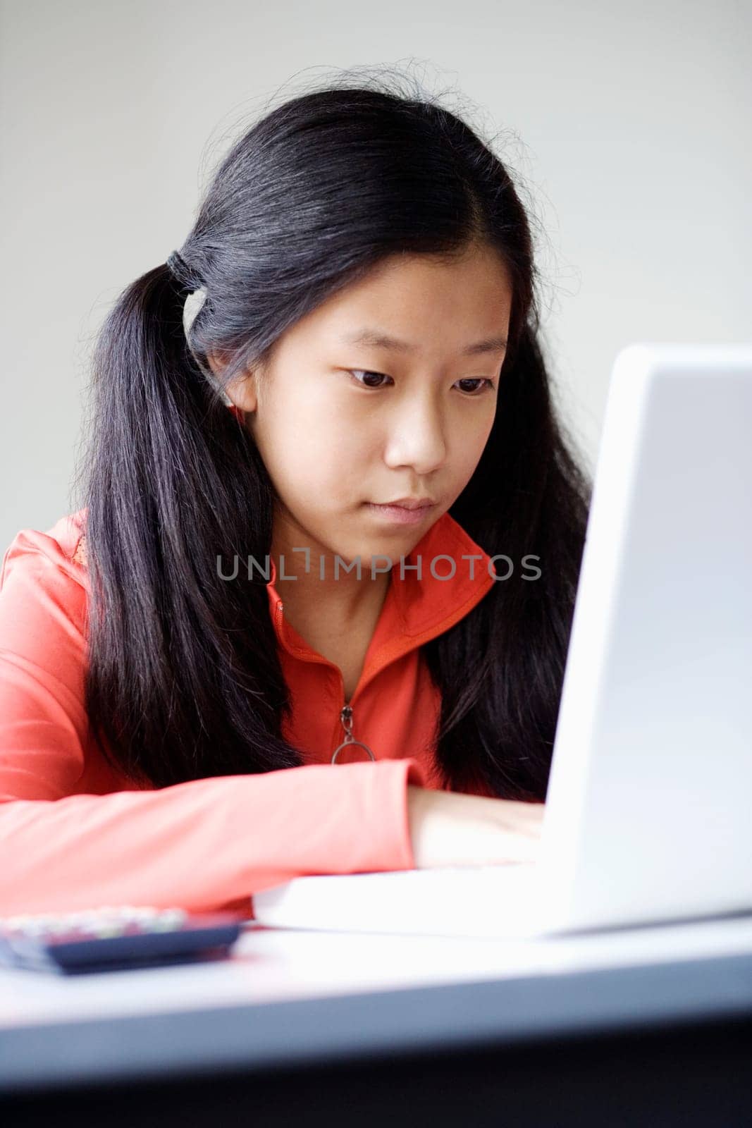 Close-up of a girl using a laptop