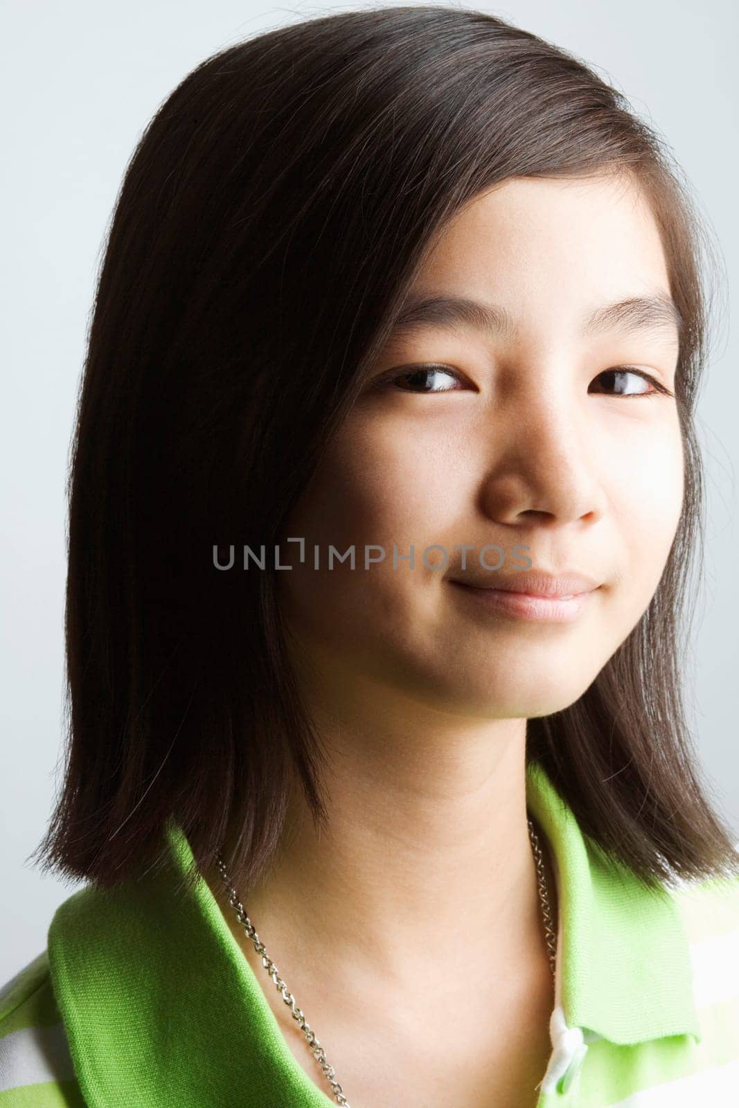 Portrait of a teenage girl smirking