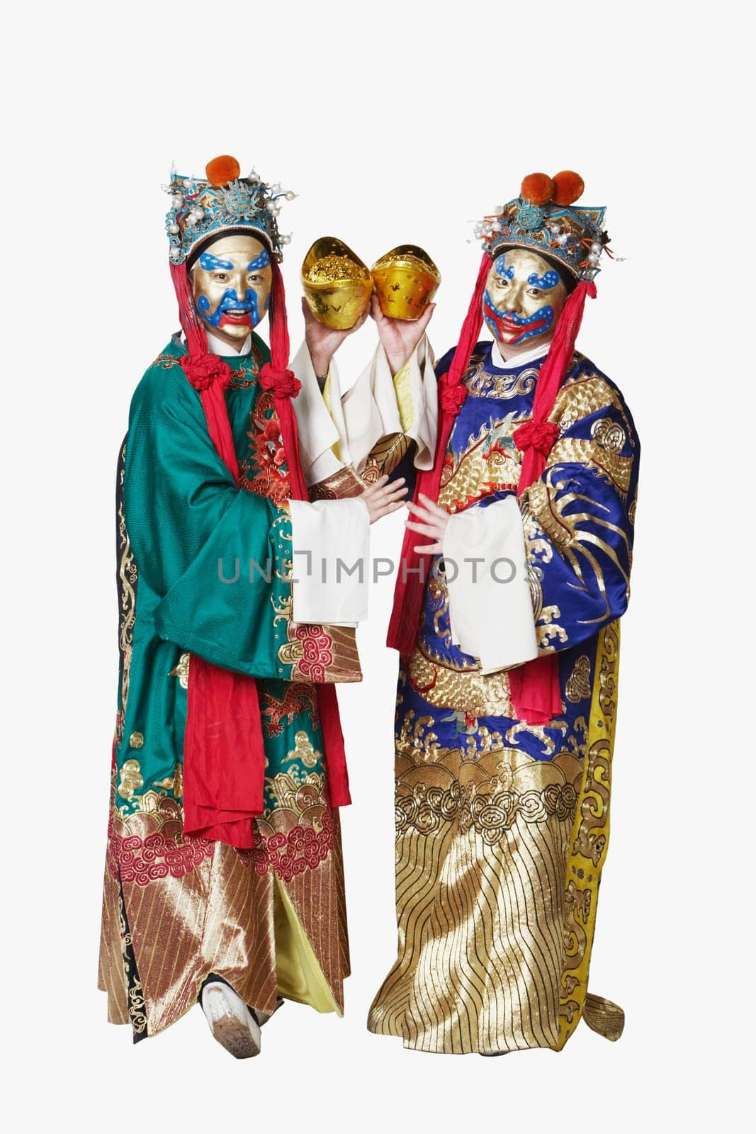Portrait of two male Chinese opera performers holding bowls full of gold coins