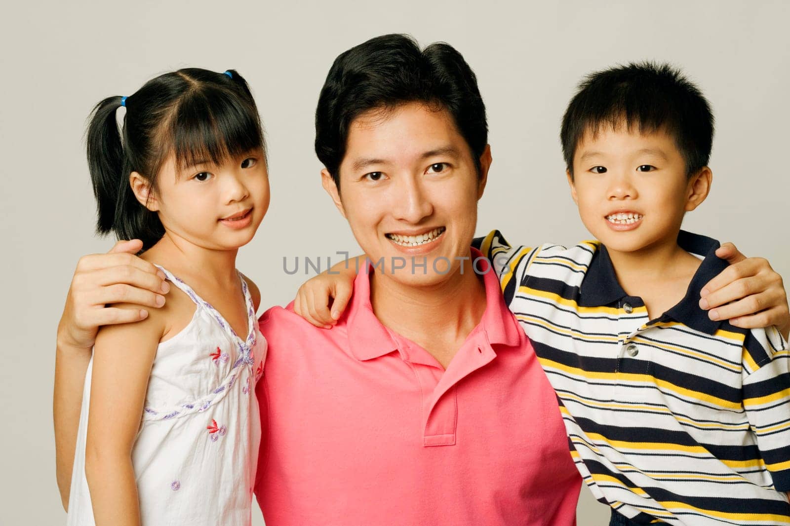 Portrait of a young man with his son and daughter