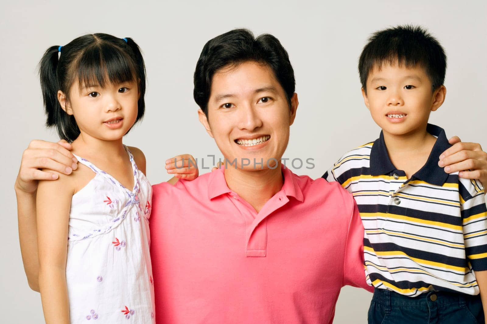Portrait of a young man with his son and daughter