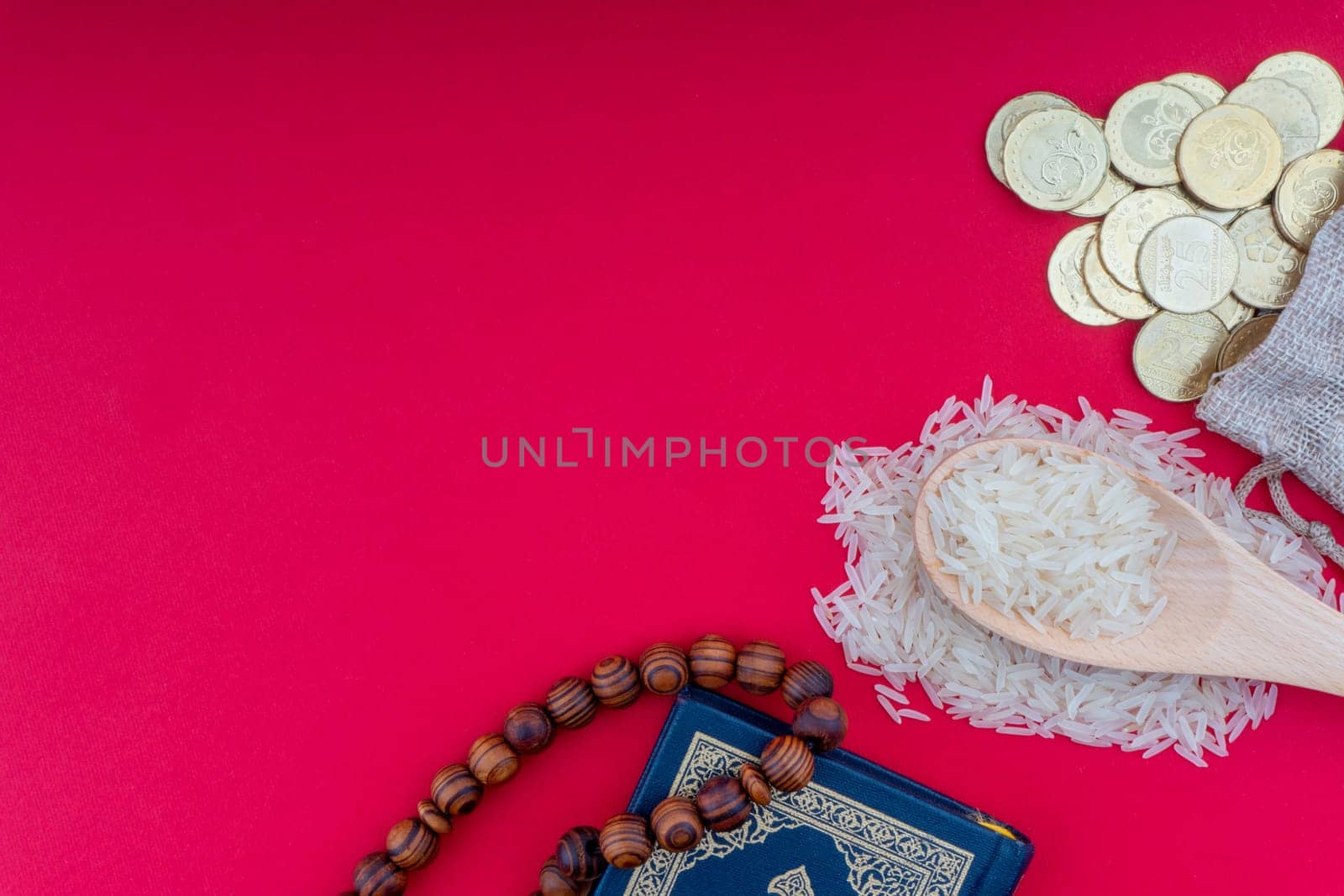 Holy Quran , Coins, Rosary and rice. Zakat concept. Zakat is a form of alm-giving as a religious obligation