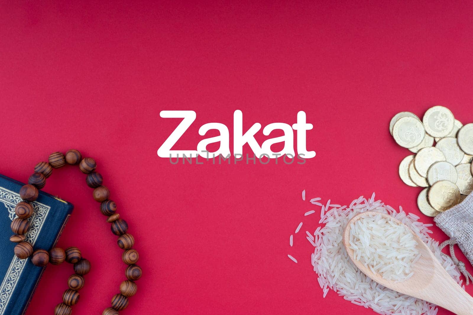 ZAKAT words with Holy Quran, Coins, Rosary and Rice. Zakat concept. Zakat is a form of alm-giving as a religious obligation