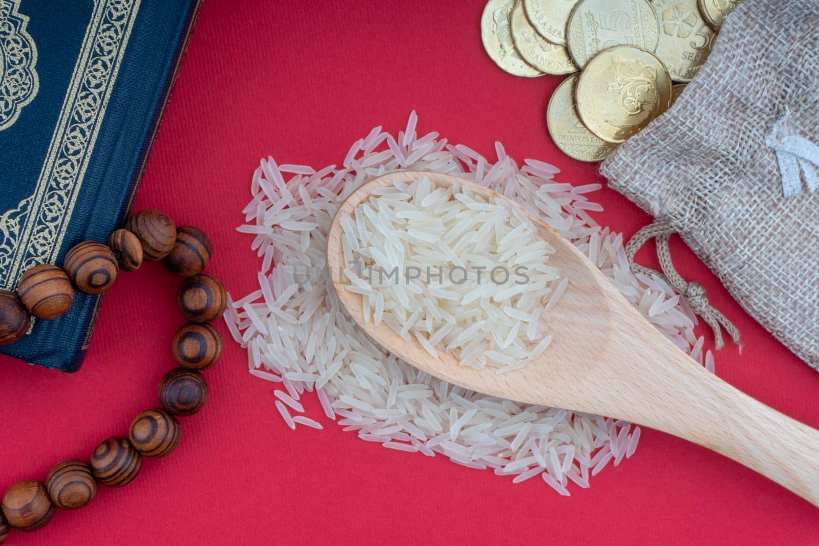 Holy Quran, Coins,Rosary and rice. Zakat concept. Zakat is a form of alm-giving as a religious obligation
